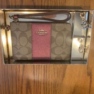 Coach Wristlet NIB comes with charms